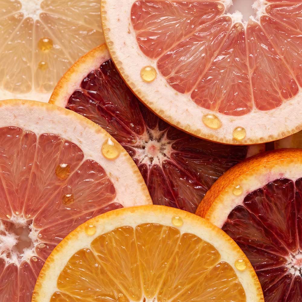 Close-up of sliced citrus with visible juice and texture.