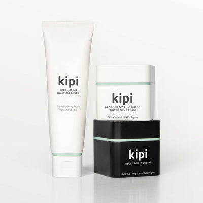 Kipi skincare products including a cleanser, day cream, and night cream on a white background