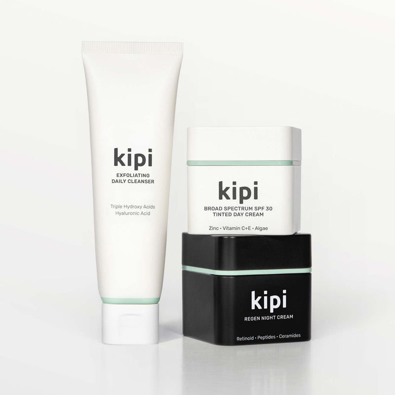 Kipi skincare products including a cleanser, day cream, and night cream on a white background